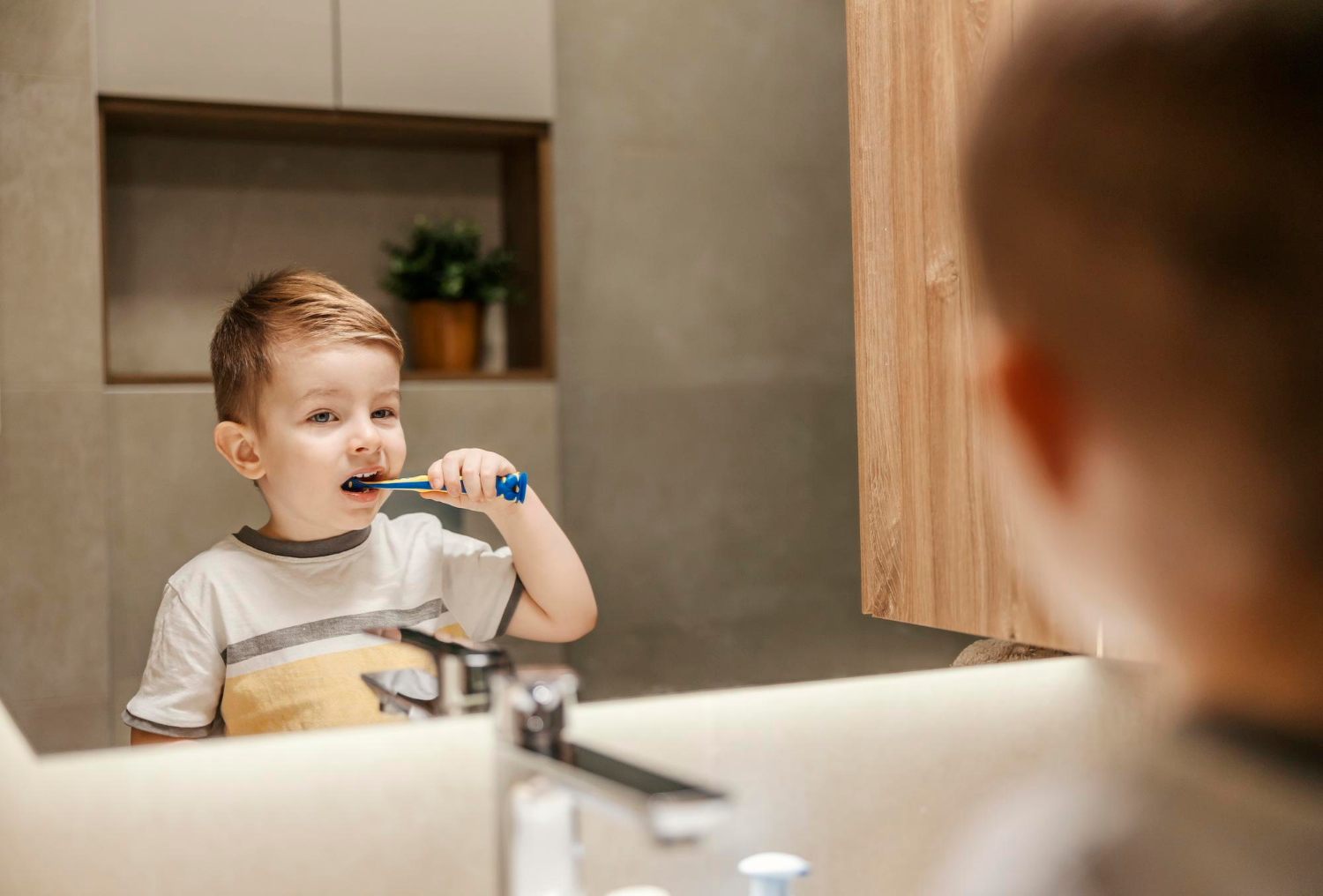 child brushing teeth