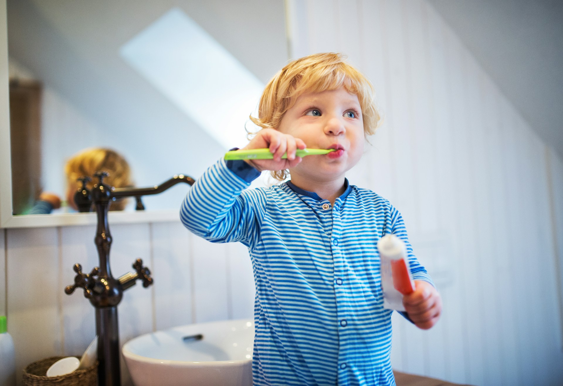child brushing teeth
